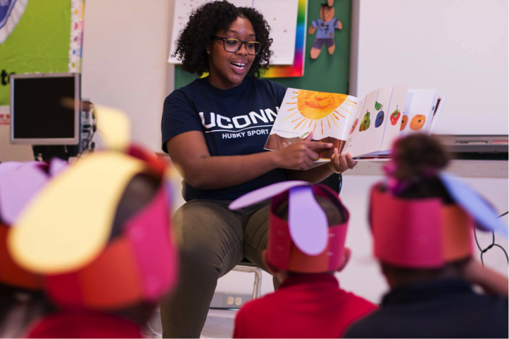 woman reading to a class