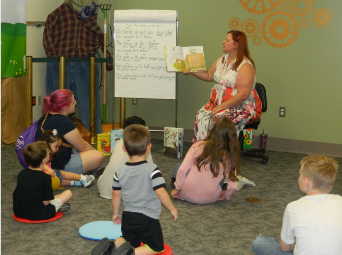 children listening to a story at the library