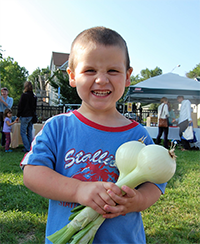 small boy with onion