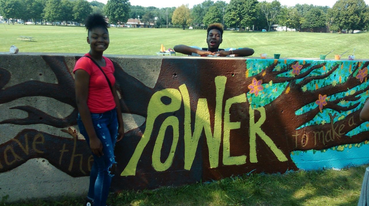 kids with a sign that says "power"
