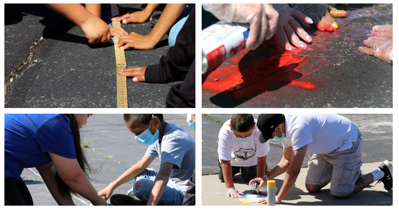 Kids stenciling on sidewalks