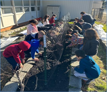 students working in a garden