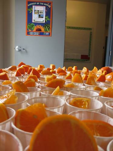 oranges in tasting cups on a table