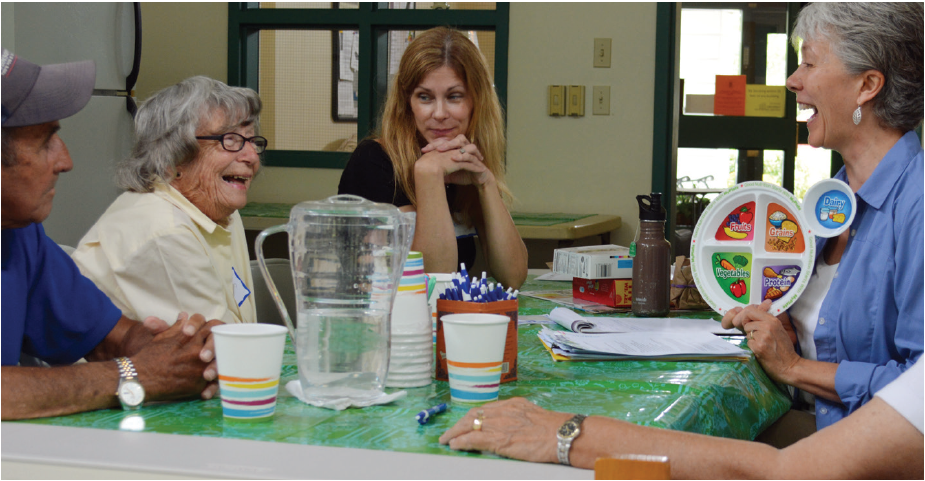 older adults talking to nutrition educator