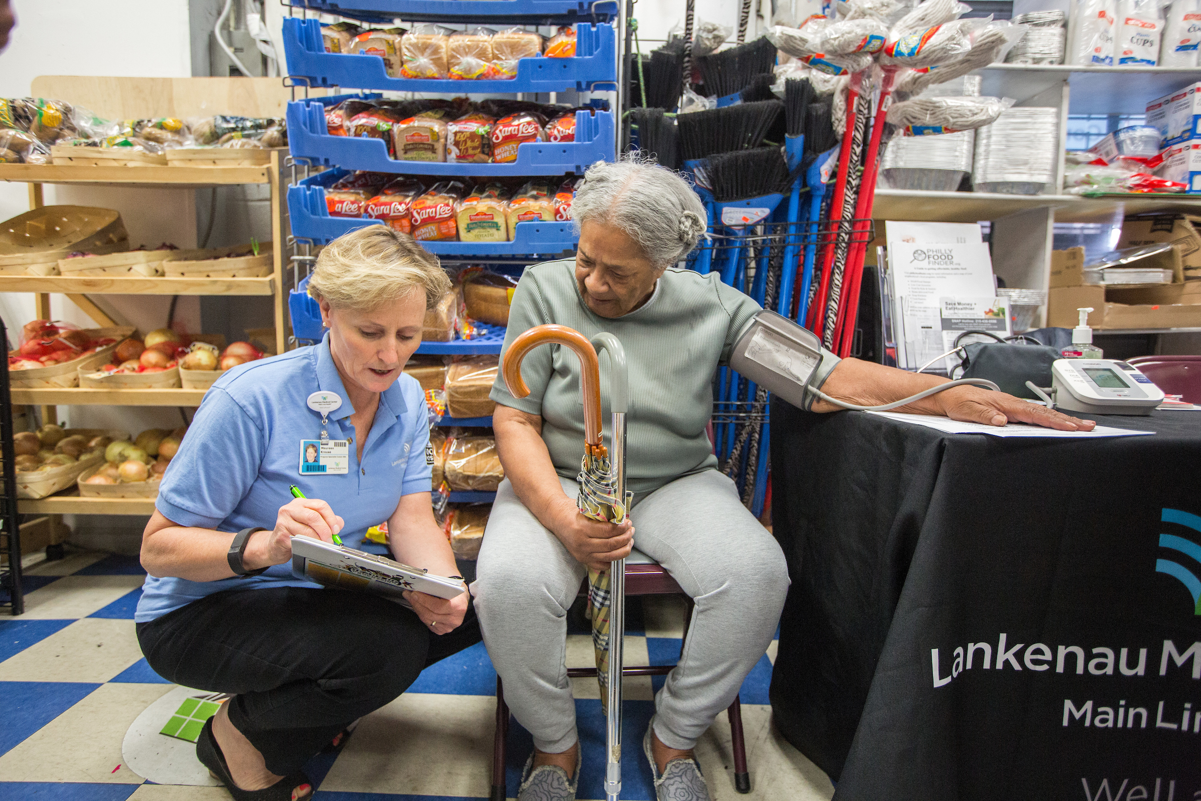 woman having her blood pressure taken