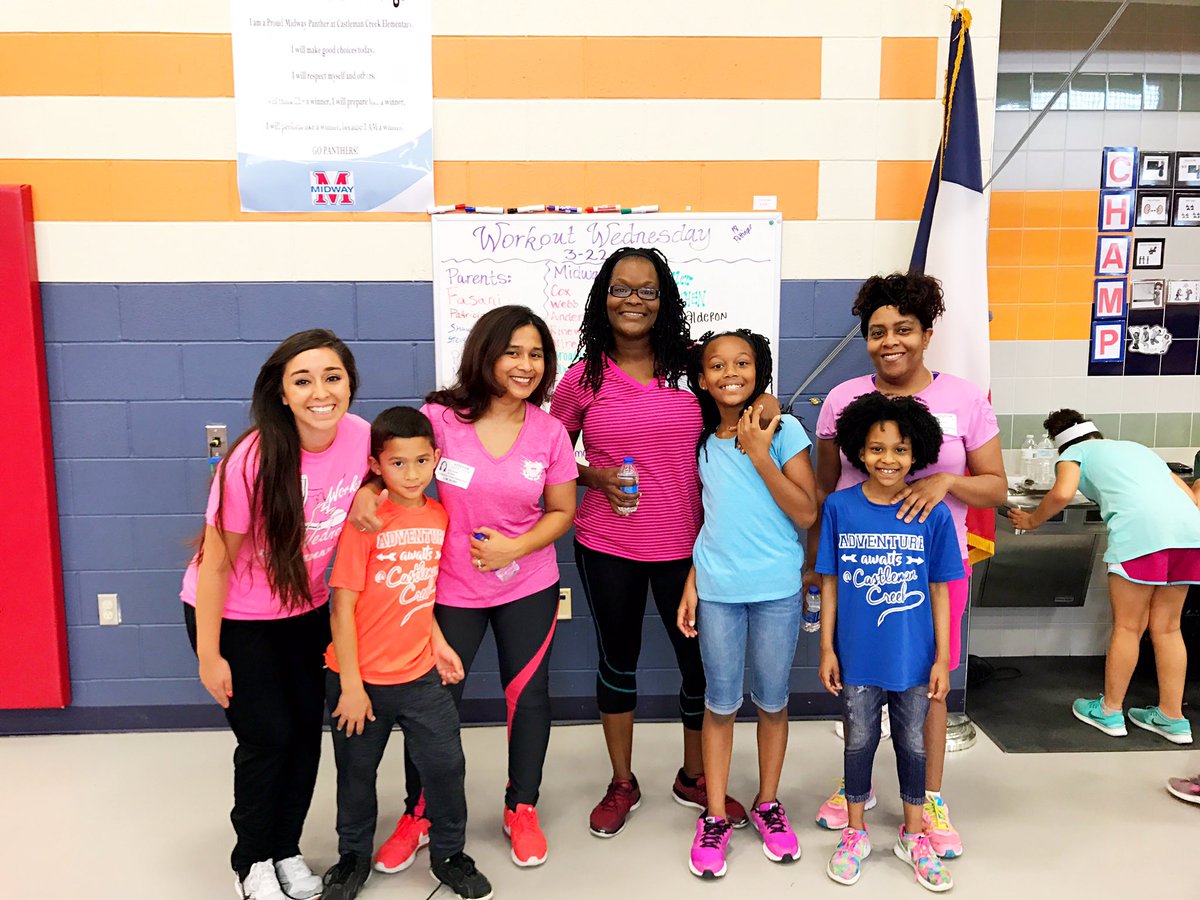 a group of girls standing with their teacher