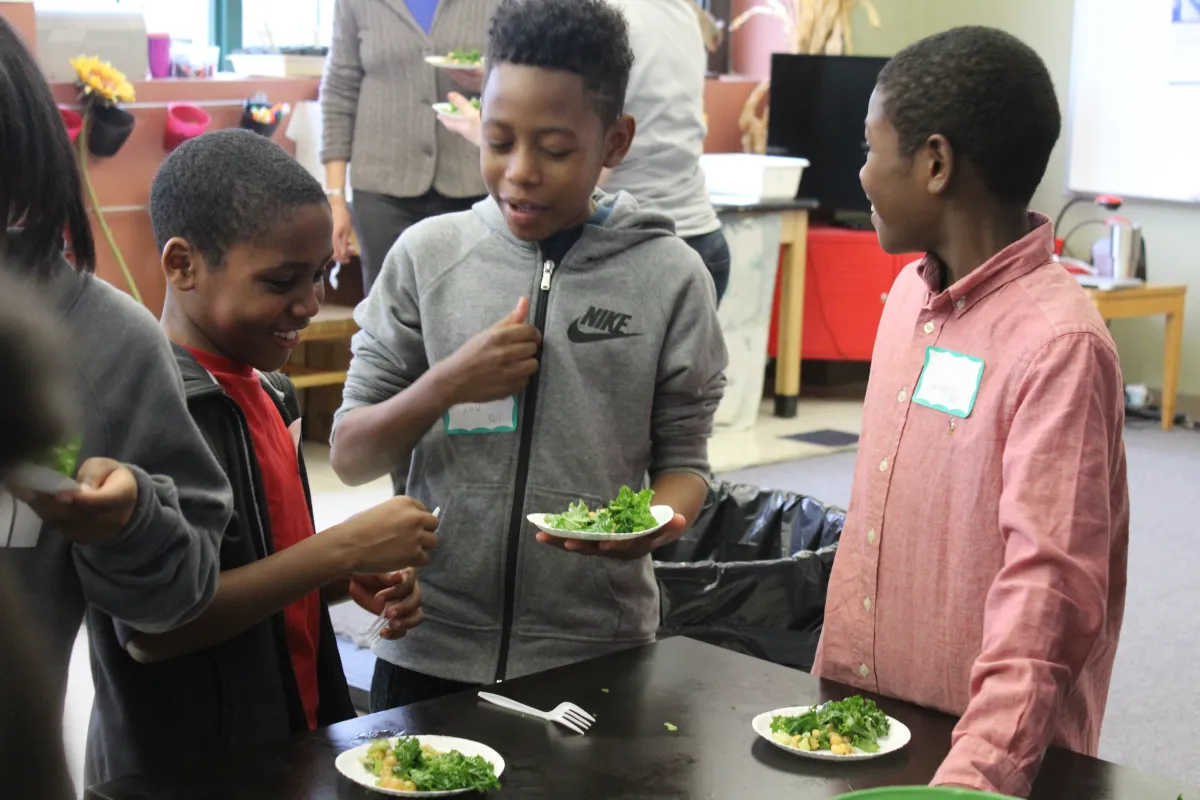 3 boys eating salad