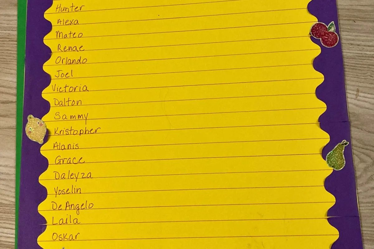 1st Grade 2-Bite Club on yellow background with a purple boarder; names written on each line down the page