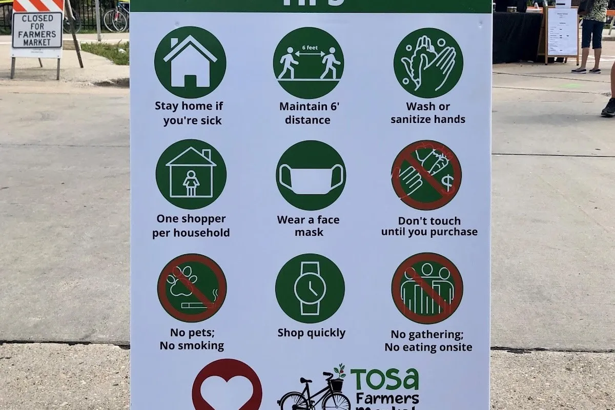 Healthy Market Tips sign at the Farmers Market include safety guidelines for shoppers during the COVID-19 pandemic
