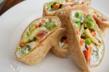 Stacked vegetable wraps on a plate