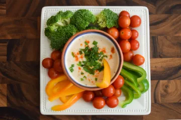 Vegetables on a plate with dip
