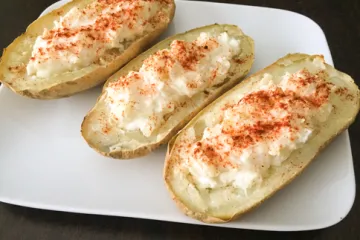 cheese stuffed potatoes on a plate