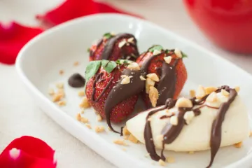 strawberries and banana with chocolate drizzled