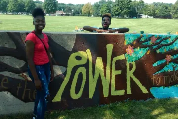 kids with a sign that says "power"