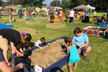 families planting a garden