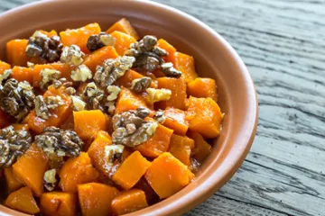 pumpkin cut into cubes and topped with walnuts