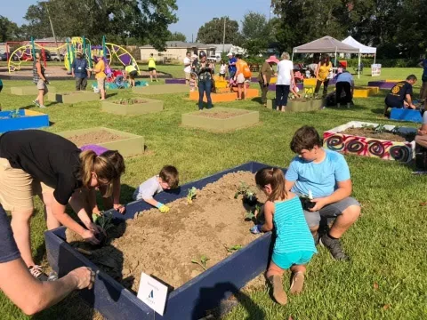 families planting a garden
