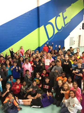 kids in a gym posing for a picture
