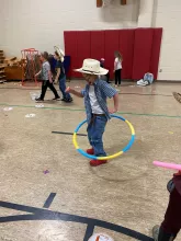 Kid playing with a hula hoop